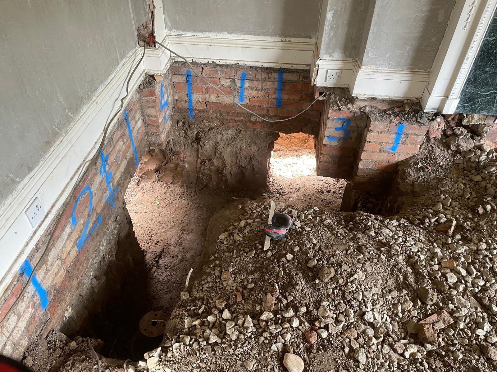 Underpinning excavation in careful numbered sections in Darlington